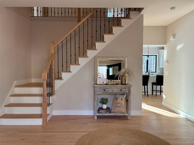 staircase featuring hardwood / wood-style floors