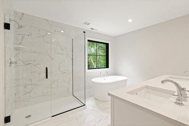 bathroom with shower with separate bathtub and vanity