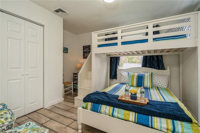 bedroom featuring a closet and hardwood / wood-style flooring