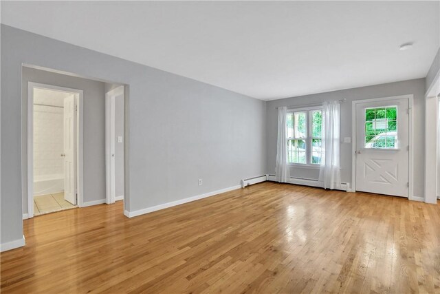 spare room featuring light wood-type flooring