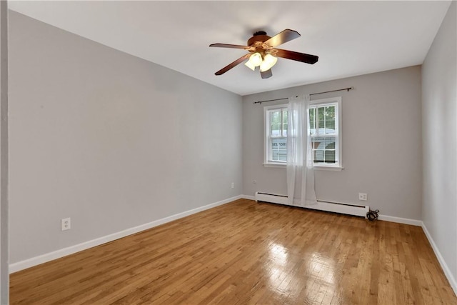 unfurnished room with ceiling fan, light wood-type flooring, and a baseboard radiator