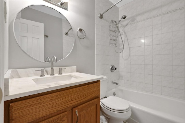 full bathroom featuring vanity, toilet, and tiled shower / bath combo