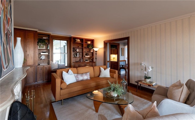 living room featuring ornamental molding and dark hardwood / wood-style floors