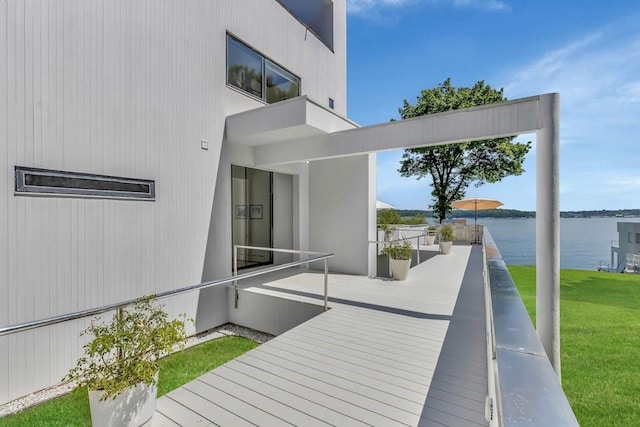 exterior space featuring a water view and a yard