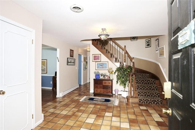 entryway with tile patterned floors and a baseboard radiator