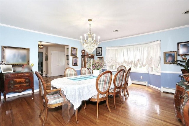 dining area featuring a chandelier, hardwood / wood-style flooring, crown molding, and a baseboard heating unit