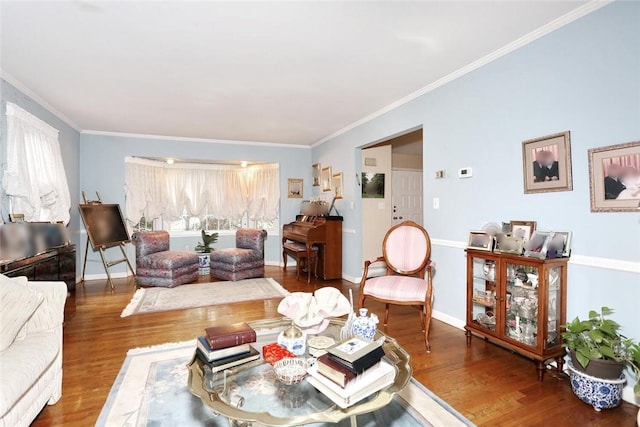 living room with hardwood / wood-style flooring and crown molding