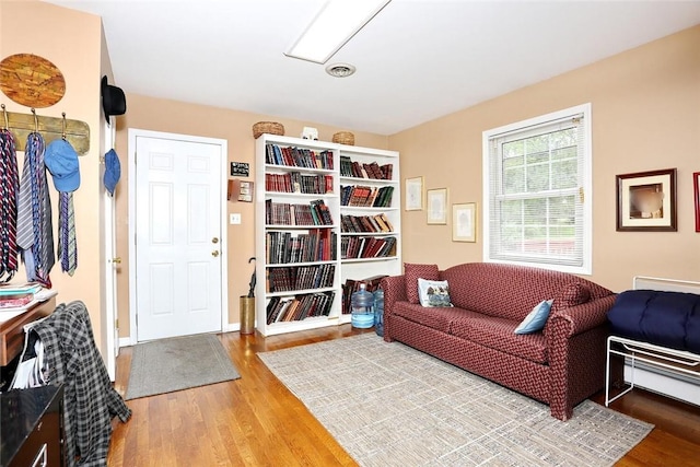 sitting room with hardwood / wood-style flooring