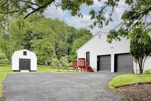 garage featuring a lawn