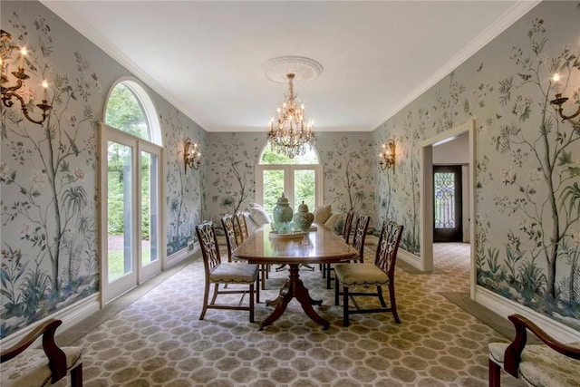 dining area featuring plenty of natural light, crown molding, and french doors