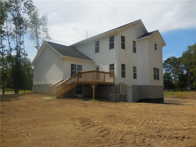 back of property featuring a wooden deck