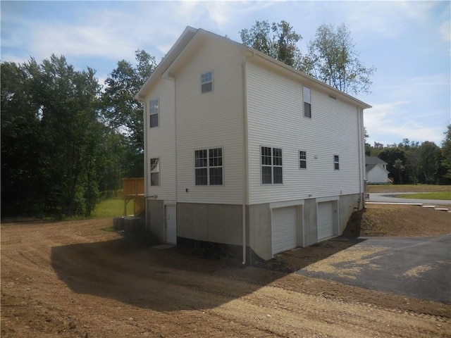 view of side of property featuring a garage