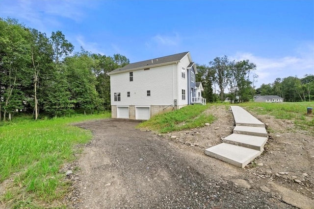 view of property exterior featuring a garage