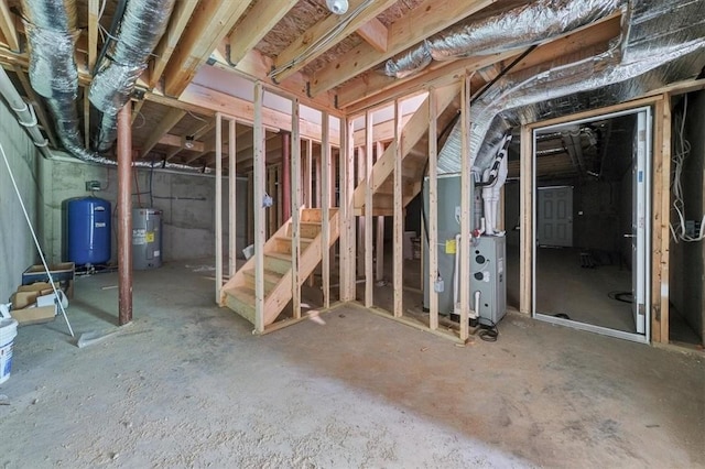 basement with electric water heater and heating unit