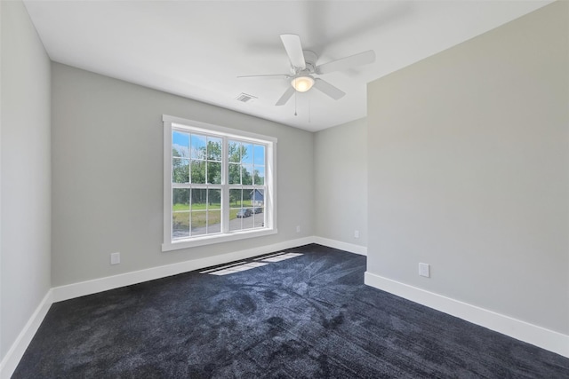 carpeted empty room featuring ceiling fan