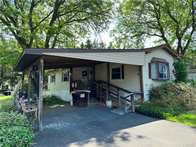 view of front of home with a carport