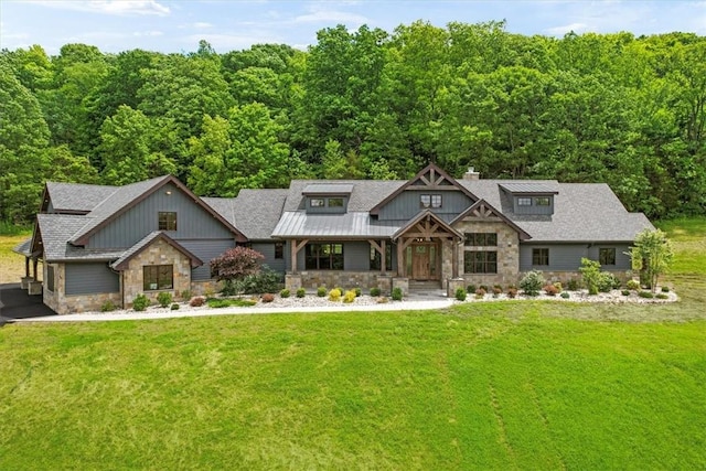 craftsman inspired home with a front yard