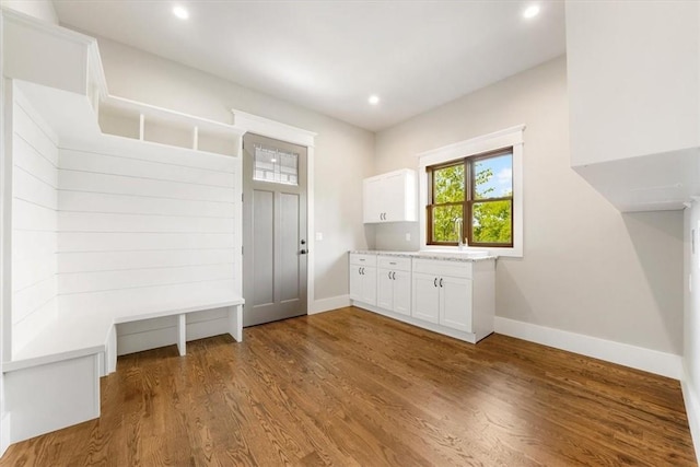 mudroom with hardwood / wood-style flooring and sink