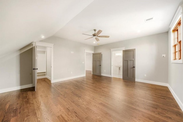 interior space featuring hardwood / wood-style flooring, ceiling fan, and lofted ceiling