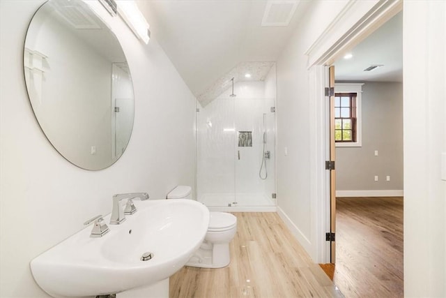 bathroom with toilet, wood-type flooring, sink, and walk in shower