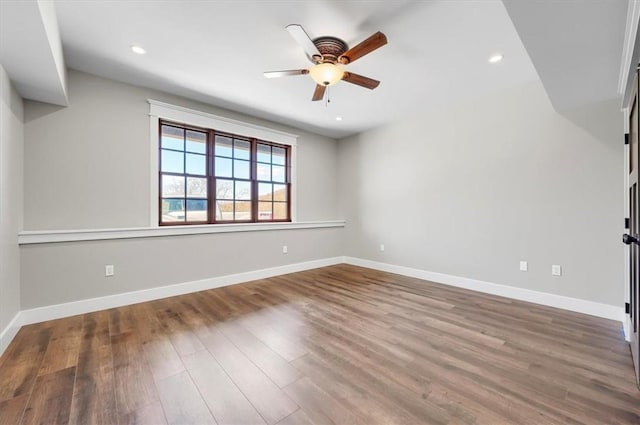 empty room featuring ceiling fan and wood-type flooring