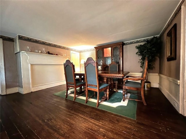 dining area with dark hardwood / wood-style floors