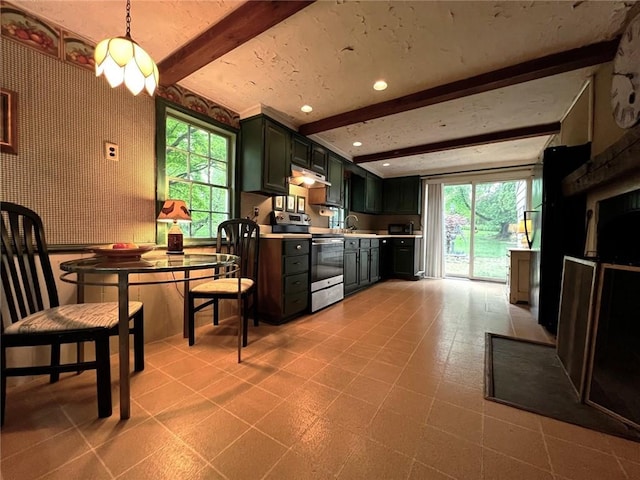 kitchen featuring beam ceiling, stainless steel electric range oven, sink, decorative light fixtures, and green cabinetry