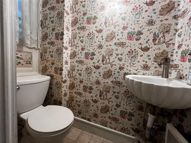 bathroom featuring tile patterned floors, sink, and toilet