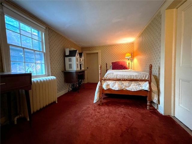 bedroom featuring carpet, radiator heating unit, and crown molding