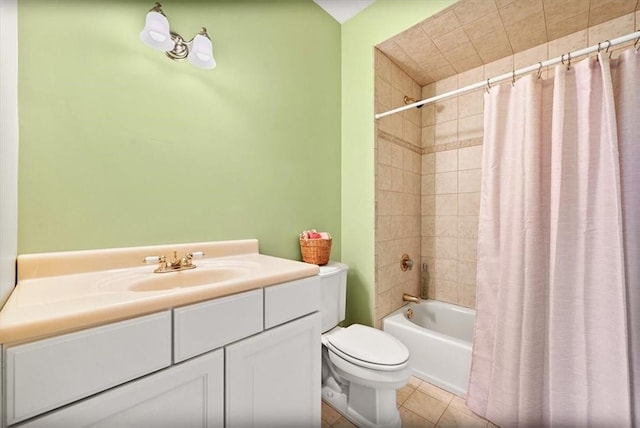 full bathroom with tile patterned flooring, shower / bath combination with curtain, vanity, and toilet