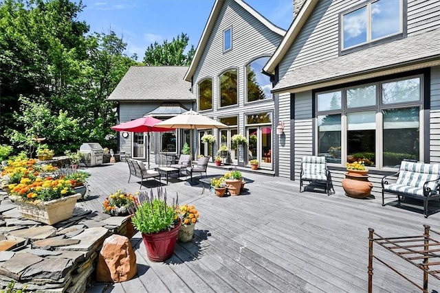 rear view of house featuring a deck