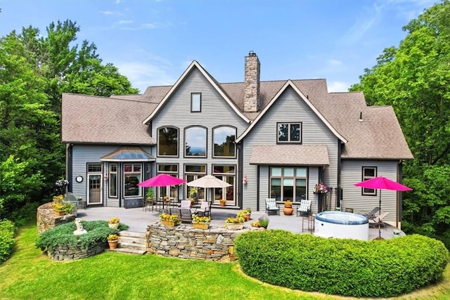 rear view of property with a patio area and a yard