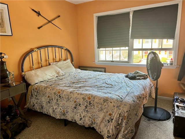 bedroom featuring carpet flooring and multiple windows