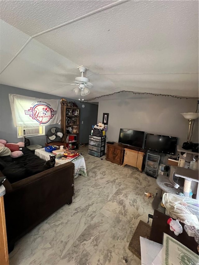 bedroom with ceiling fan and a textured ceiling