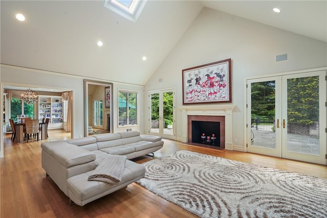 9 Lincoln Woods, Purchase, NY 10577 - living room with hardwood / wood-style floors, high vaulted ceiling, and french doors
