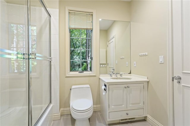 9 Lincoln Woods, Purchase, NY 10577 - full bathroom with toilet, tile patterned flooring, vanity, and combined bath / shower with glass door