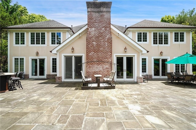 9 Lincoln Woods, Purchase, NY 10577 - back of house with french doors and a patio