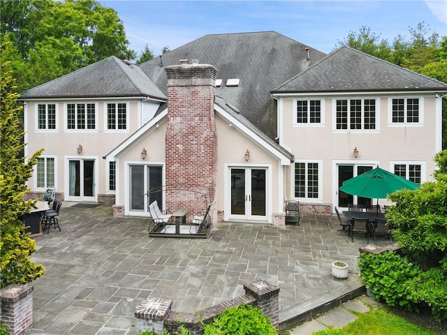 9 Lincoln Woods, Purchase, NY 10577 - back of property with a patio area and french doors