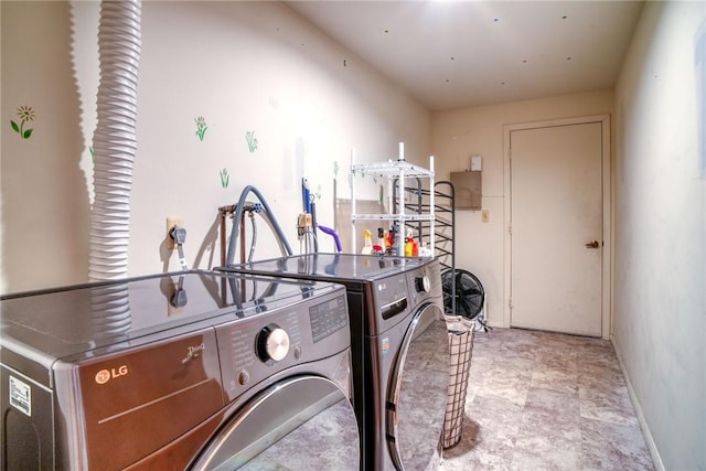 washroom with washing machine and dryer