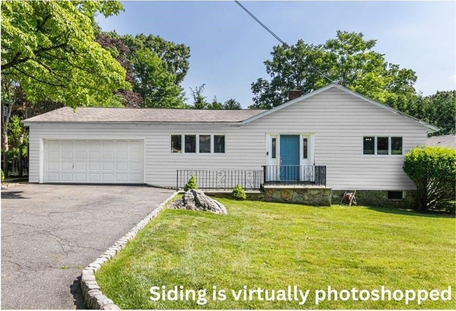 37 Capt Honeywells Rd, Ardsley, NY 10502 - ranch-style home featuring a front yard and a garage