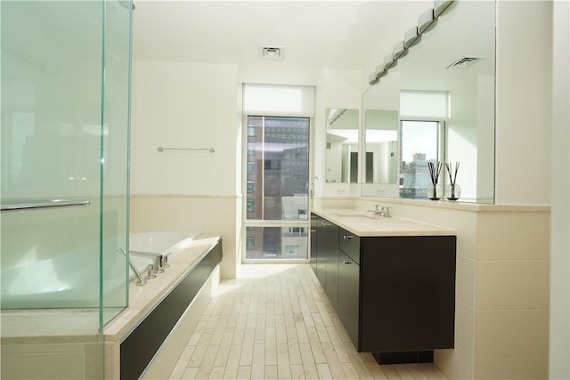 bathroom featuring a tub and vanity