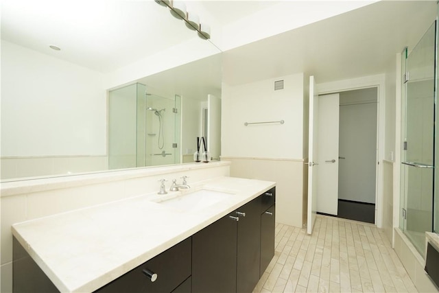 bathroom featuring vanity and walk in shower