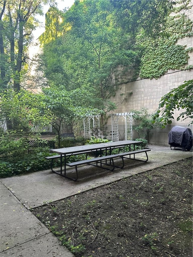 view of home's community with a patio area