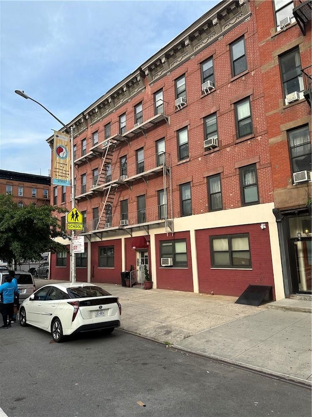 view of building exterior with cooling unit