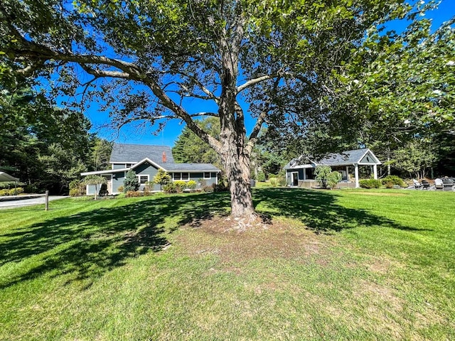 ranch-style house with a front lawn