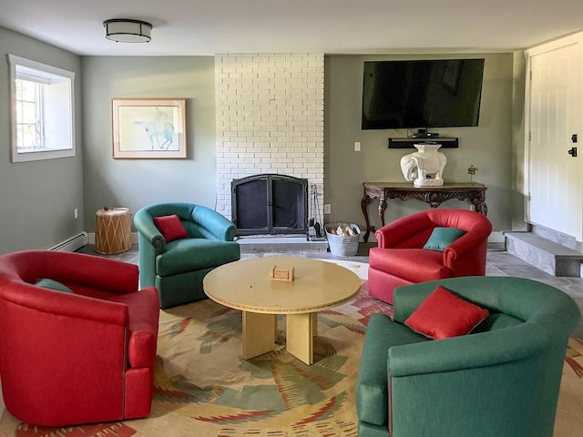 living room with a fireplace and a baseboard heating unit