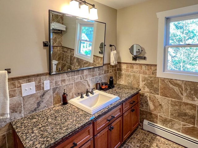 bathroom featuring vanity, toilet, and a baseboard heating unit