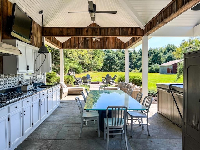 view of patio / terrace featuring a gazebo and ceiling fan