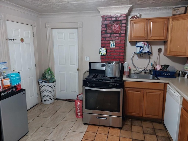 kitchen with light tile patterned flooring, sink, and stainless steel appliances