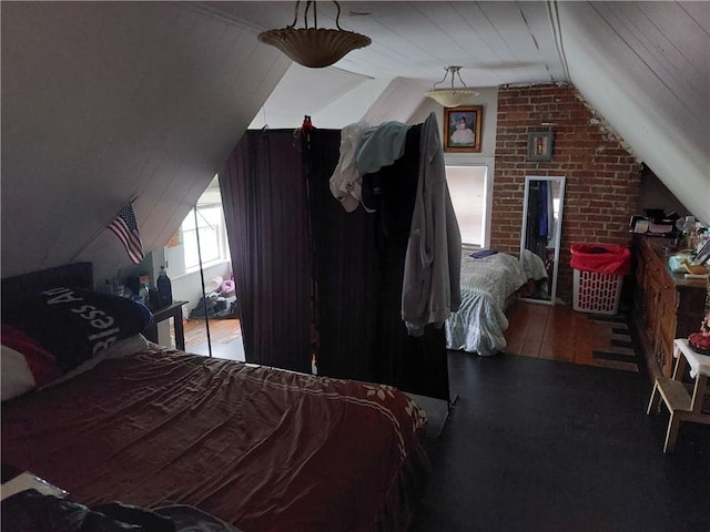 bedroom featuring wood-type flooring and vaulted ceiling